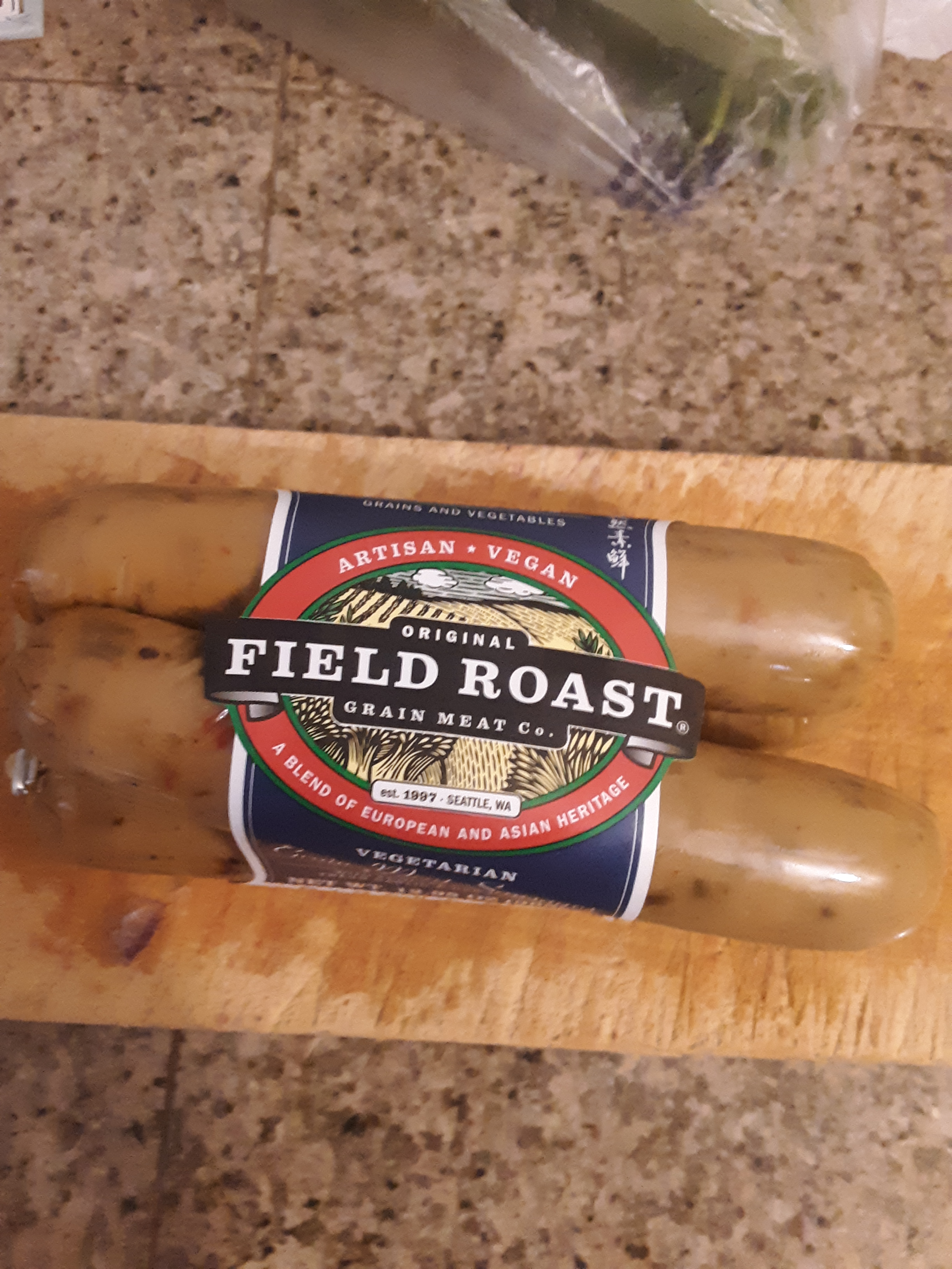 Living well in the 21st century - Limassol, Cyprus - a picture of field roast grain meat co. - est. 1997 - Seattle, WA - the label is blue, red and white. Sausage is wrapped in casing, and the label is wrapped around the sausage.  