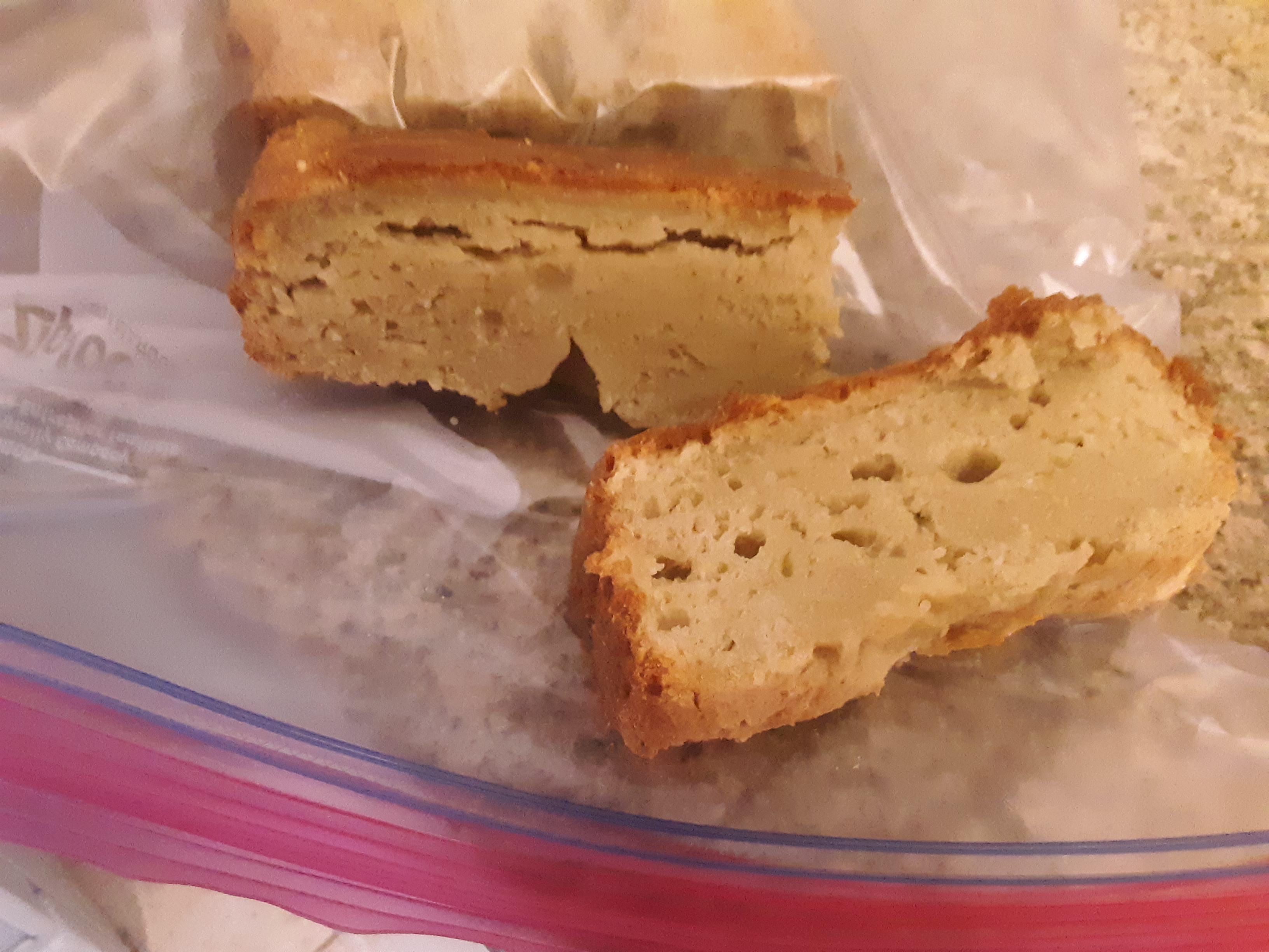 Living well in the 21st century - Limassol, Cyprus - picture of gluten free bread with air bubbles in the middle. The bread is placed on top of a ziplock bag.  