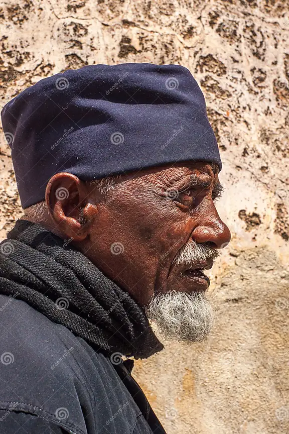 Living well in 21st century-Limassol, Cyprus. A picture of an Ethiopia monk with a stone background. 